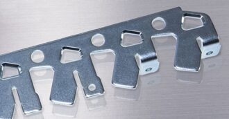 Progressive stamping strip