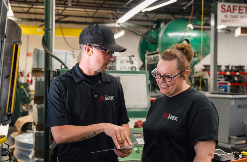 Ajax Vice President of Operations Brandon Holmes helps train Ajax colleagues