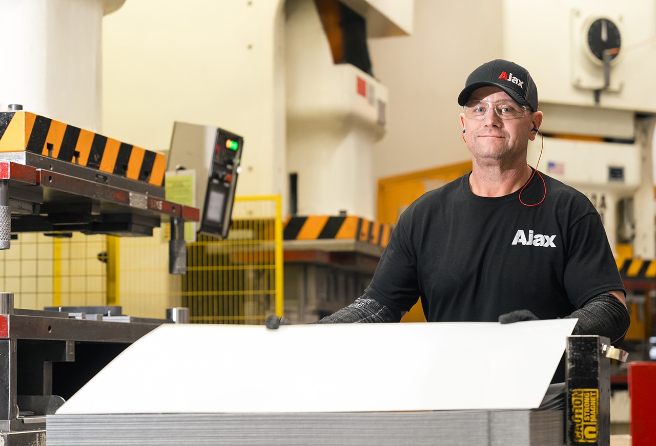 Ajax Colleague Josh Bullock operates a servo press.